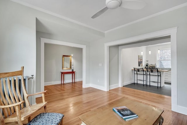 137 Freeman St Unit 3A, Brookline, MA 02446 - living area with crown molding, ceiling fan, wood finished floors, and baseboards