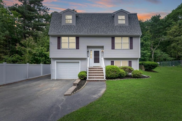 27 Harnden Rd, Billerica, MA 01821 - bi-level home featuring asphalt driveway, a shingled roof, and a garage