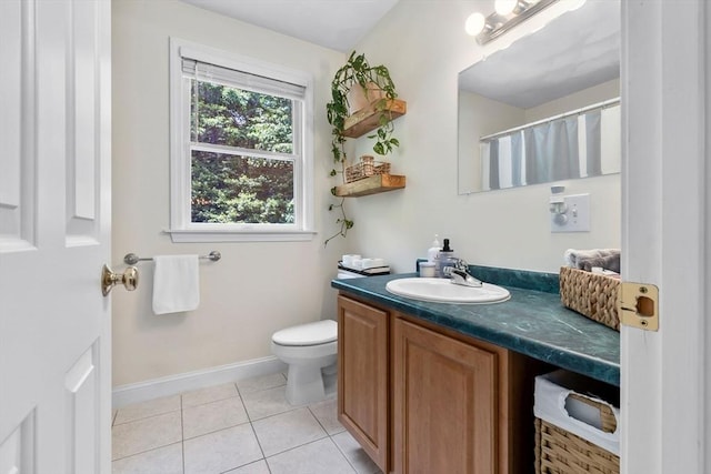 27 Harnden Rd, Billerica, MA 01821 - full bathroom featuring vanity, tile patterned floors, toilet, and baseboards
