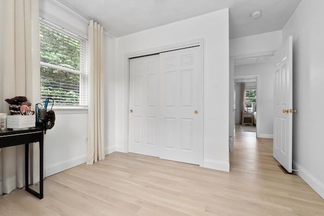 27 Harnden Rd, Billerica, MA 01821 - bedroom featuring light wood-style floors, baseboards, and a closet