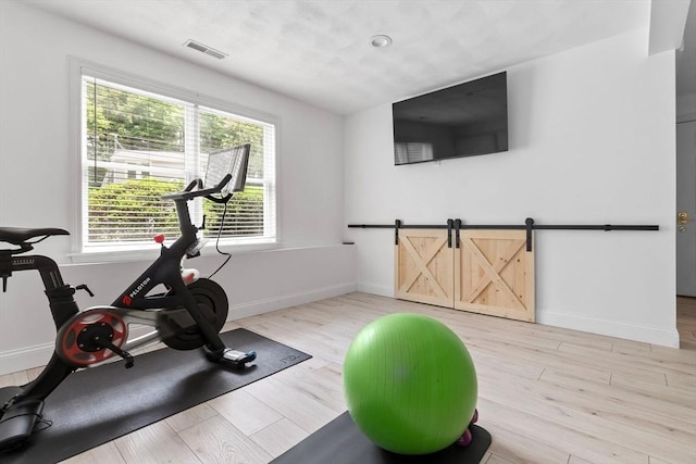 27 Harnden Rd, Billerica, MA 01821 - workout room featuring light wood-style flooring and baseboards