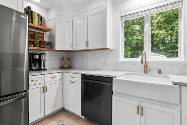 27 Harnden Rd, Billerica, MA 01821 - kitchen featuring freestanding refrigerator, black dishwasher, a sink, open shelves, and light countertops