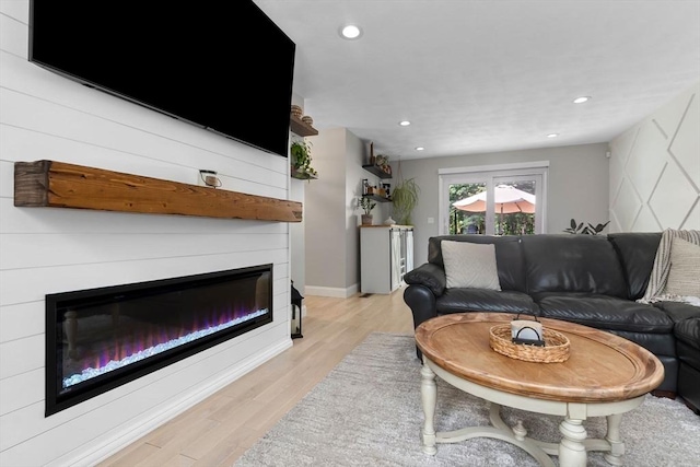 27 Harnden Rd, Billerica, MA 01821 - living area featuring a glass covered fireplace, light wood finished floors, recessed lighting, and baseboards