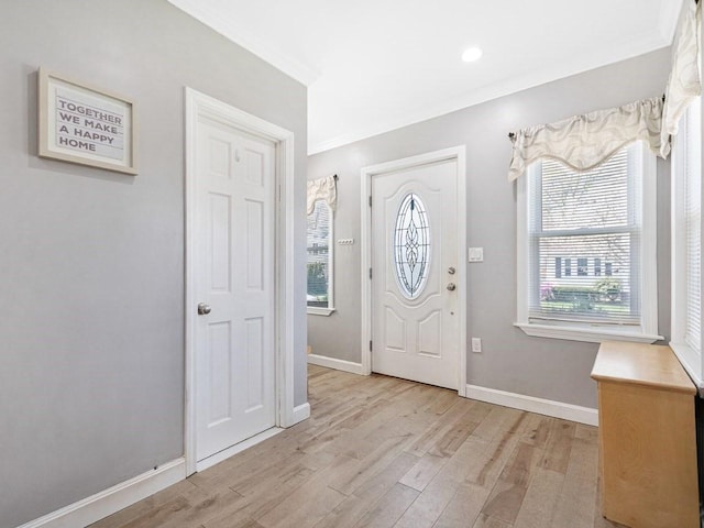 55 Bruce Rd, Waltham, MA 02453 - foyer entrance with ornamental molding, light wood-style floors, and baseboards