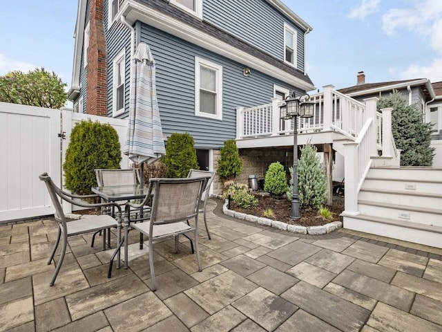 55 Bruce Rd, Waltham, MA 02453 - view of patio / terrace featuring outdoor dining area, stairs, a deck, and a gate