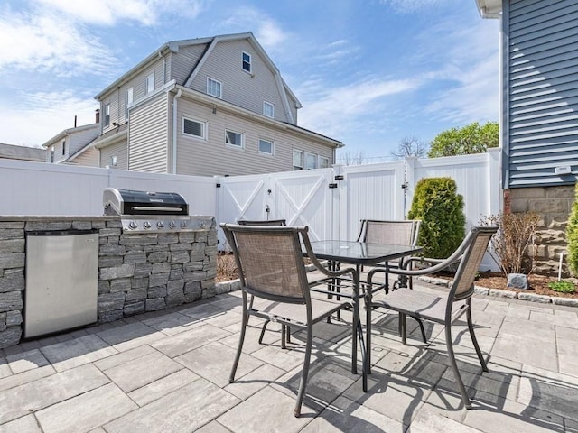 55 Bruce Rd, Waltham, MA 02453 - fenced backyard with a gate, a patio, and outdoor dining area