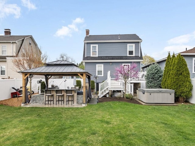 55 Bruce Rd, Waltham, MA 02453 - rear view of house featuring a hot tub, a chimney, a gazebo, a patio, and stairs