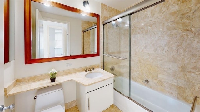 full bathroom featuring vanity, toilet, and enclosed tub / shower combo