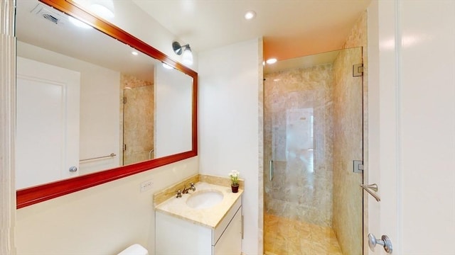 bathroom featuring vanity and an enclosed shower