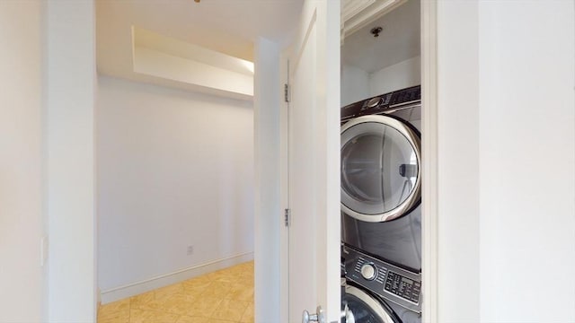 laundry room with stacked washer / drying machine