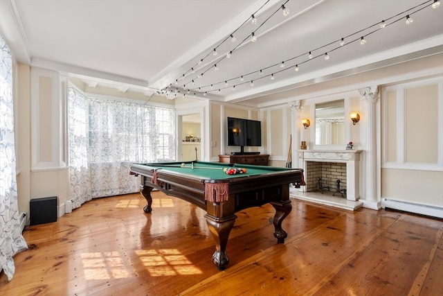 recreation room with hardwood / wood-style floors, a baseboard radiator, billiards, and track lighting