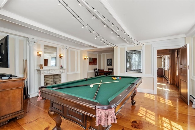 rec room featuring hardwood / wood-style floors, pool table, track lighting, and a brick fireplace