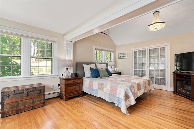 bedroom with an AC wall unit, lofted ceiling with beams, a baseboard heating unit, a notable chandelier, and light hardwood / wood-style flooring