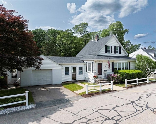 14 Alden St Unit 14, Milford, MA 01757 - view of front of house featuring driveway, a chimney, a garage, and a shingled roof