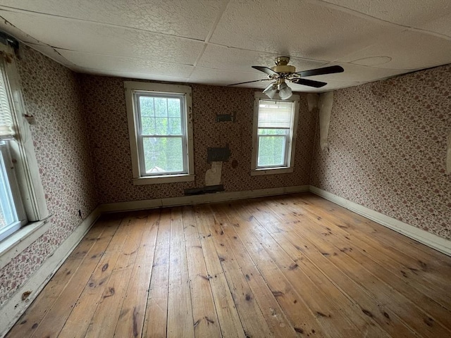 7 Little River St, Haverhill, MA 01832 - empty room featuring wallpapered walls, light wood-style flooring, baseboards, and ceiling fan