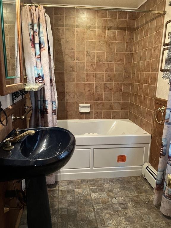 7 Little River St, Haverhill, MA 01832 - full bath featuring shower / bath combo, a baseboard heating unit, and a sink