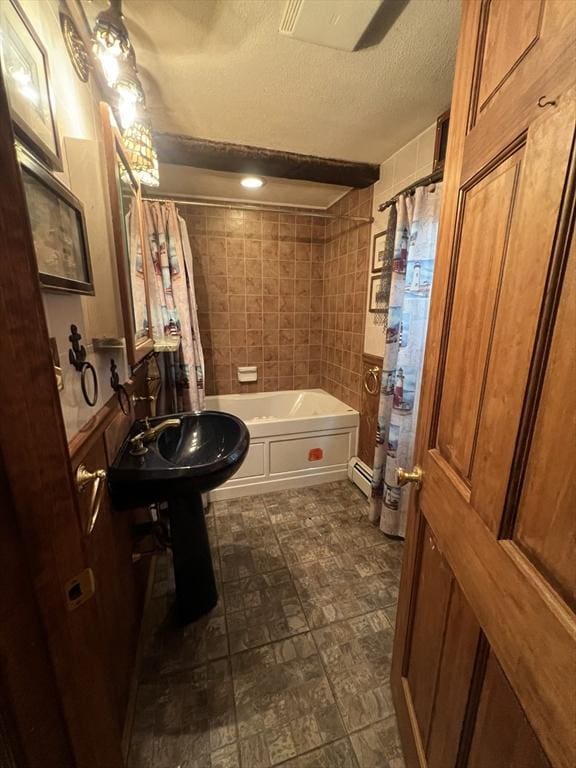 7 Little River St, Haverhill, MA 01832 - full bathroom with a textured ceiling, shower / bath combination with curtain, and baseboard heating