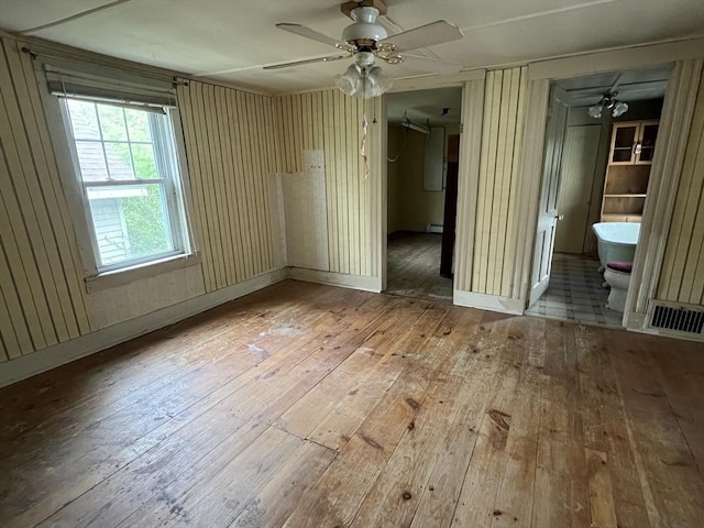 7 Little River St, Haverhill, MA 01832 - empty room featuring hardwood / wood-style floors, a ceiling fan, and a baseboard radiator