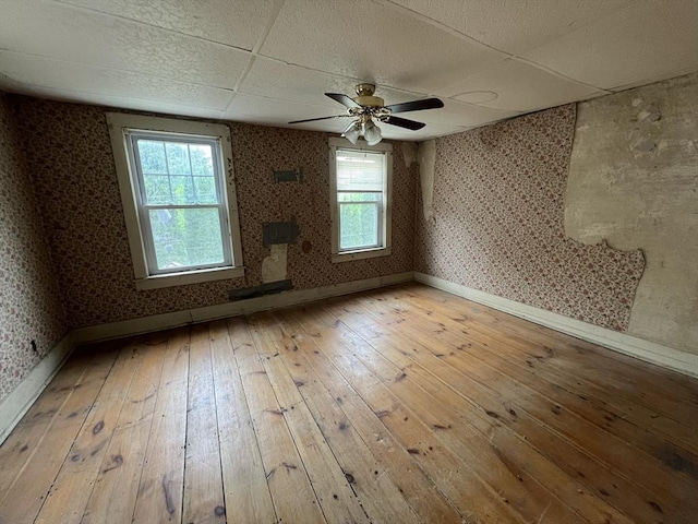 7 Little River St, Haverhill, MA 01832 - unfurnished room with baseboards, wallpapered walls, hardwood / wood-style flooring, and ceiling fan