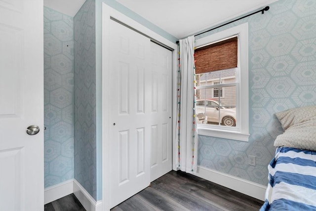 242 Old Wharf Rd Unit B4, Dennis, MA 02639 - bedroom with wallpapered walls, baseboards, dark wood-style floors, and a closet