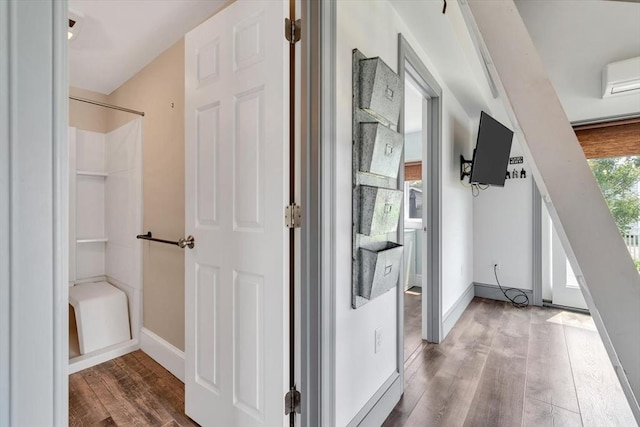 242 Old Wharf Rd Unit B4, Dennis, MA 02639 - hall featuring wood finished floors, baseboards, and a wall unit AC