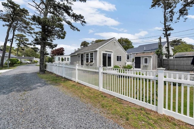 242 Old Wharf Rd Unit B4, Dennis, MA 02639 - view of front facade with roof with shingles and gravel driveway