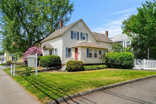 65 Holten St, Danvers, MA 01923 - traditional-style house with a gate, cooling unit, and a shingled roof