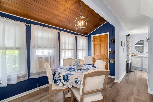 65 Holten St, Danvers, MA 01923 - dining room with vaulted ceiling, wood finished floors, a chandelier, baseboards, and wooden ceiling