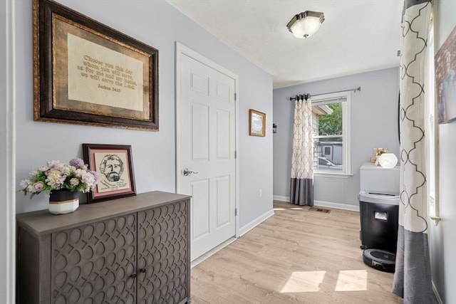 65 Holten St, Danvers, MA 01923 - hallway featuring light wood finished floors and baseboards