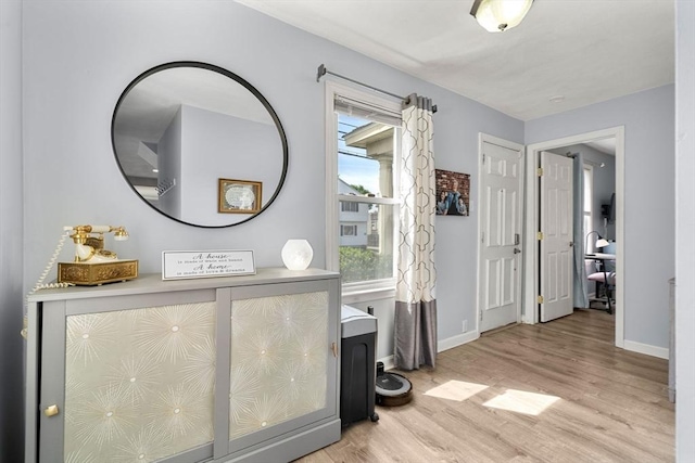 65 Holten St, Danvers, MA 01923 - corridor featuring wood finished floors and baseboards