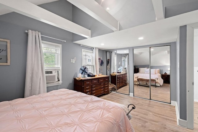 65 Holten St, Danvers, MA 01923 - bedroom featuring two closets, light wood-style flooring, cooling unit, recessed lighting, and vaulted ceiling