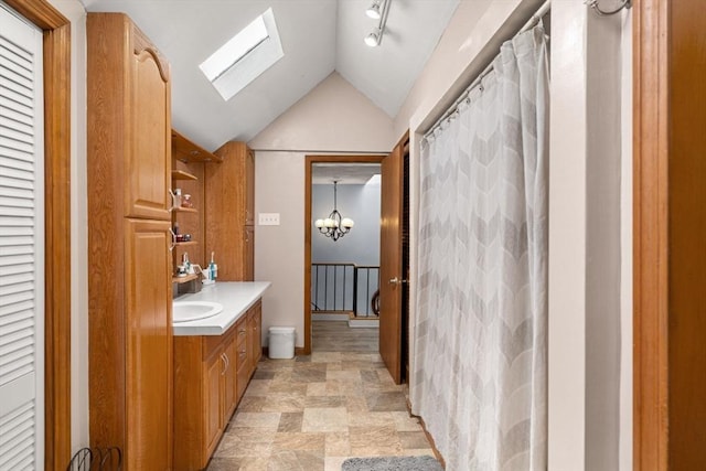 65 Holten St, Danvers, MA 01923 - full bath with a skylight, vanity, lofted ceiling, a closet, and stone finish floors