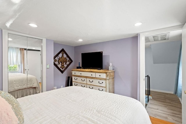 65 Holten St, Danvers, MA 01923 - bedroom featuring light wood-type flooring, recessed lighting, a closet, and baseboards