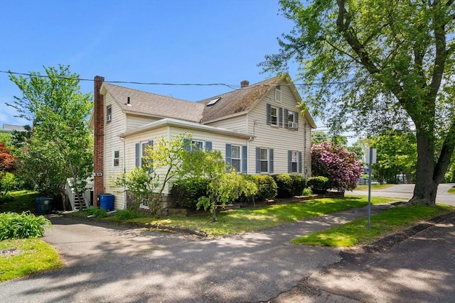 65 Holten St, Danvers, MA 01923 - view of side of property featuring a chimney