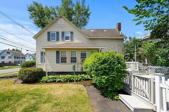 65 Holten St, Danvers, MA 01923 - view of front of house with a chimney and a shingled roof