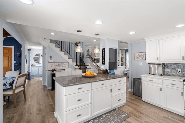 65 Holten St, Danvers, MA 01923 - kitchen featuring light wood-type flooring, a center island, white cabinetry, recessed lighting, and hanging light fixtures
