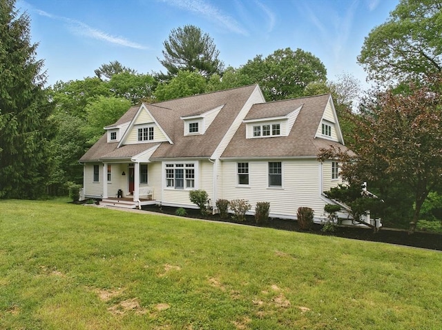 93 Cricket Ln, North Andover, MA 01845 - view of front of home with a front lawn, roof with shingles, and view of scattered trees