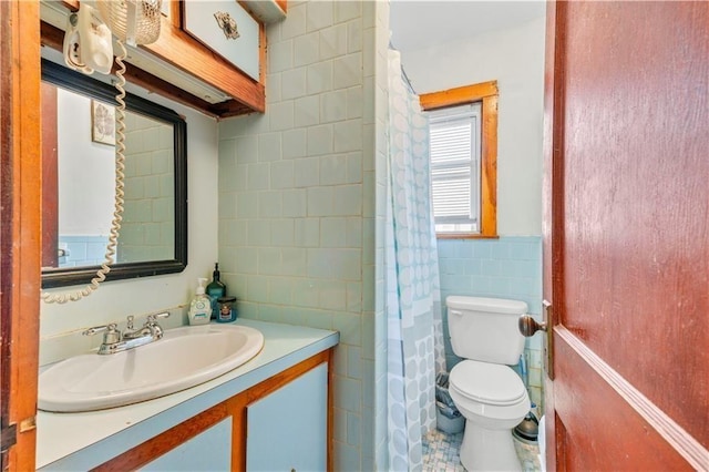 75 Winthrop Ave, West Warwick, RI 02893 - bathroom with tile walls, toilet, vanity, wainscoting, and a shower with curtain