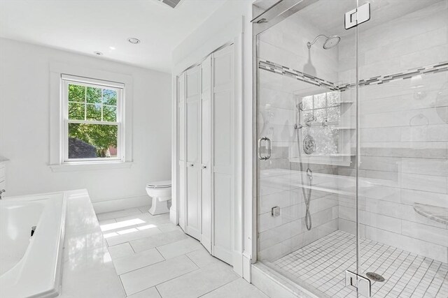 bathroom with a stall shower, a bath, toilet, tile patterned flooring, and recessed lighting