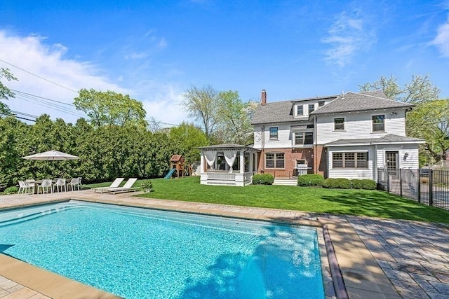 view of pool with a patio, a playground, and a gazebo