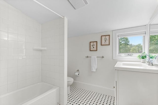 full bathroom with toilet, tile patterned flooring, baseboards, vanity, and washtub / shower combination