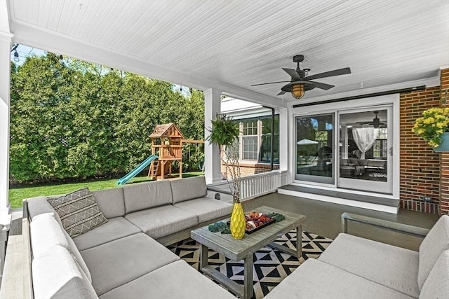 sunroom with an outdoor living space and a ceiling fan