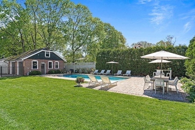 view of pool featuring a patio area and an outbuilding