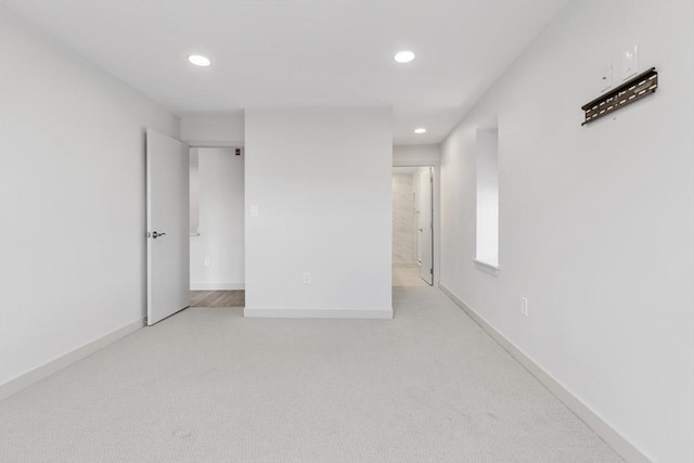 spare room with light colored carpet