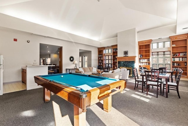 playroom with built in shelves, pool table, high vaulted ceiling, carpet flooring, and a fireplace