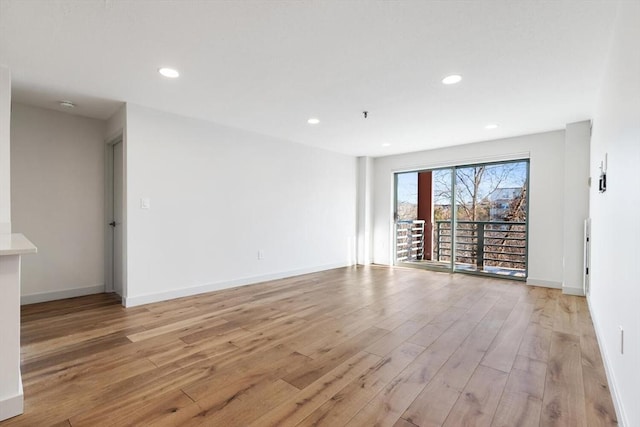 unfurnished room featuring light hardwood / wood-style flooring