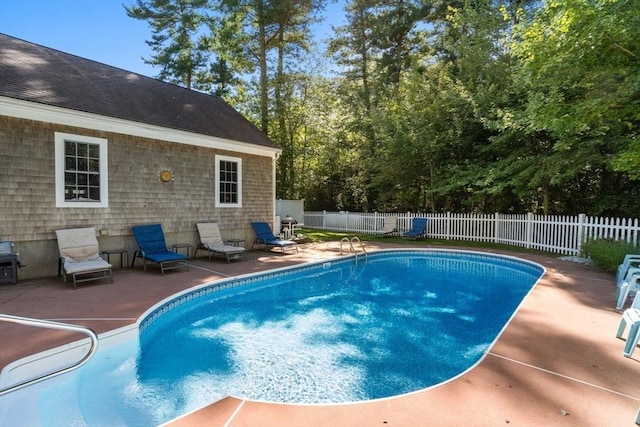 view of pool with a fenced backyard, a fenced in pool, and a patio