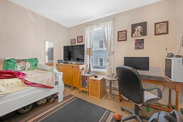 carpeted bedroom with baseboard heating