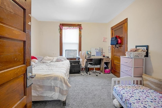 bedroom featuring carpet