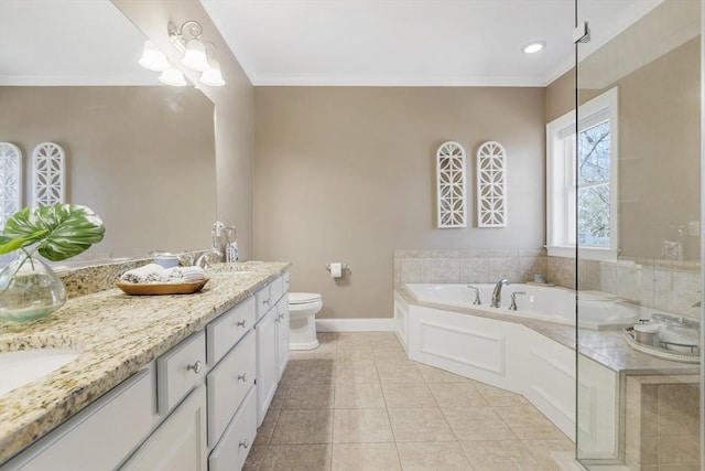 full bathroom with double vanity, toilet, tile patterned floors, baseboards, and a garden tub